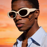 Stylish young man wearing white sunglasses outdoors