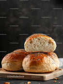Fresh Baked Sesame Seed Bread Rolls on Wooden Board