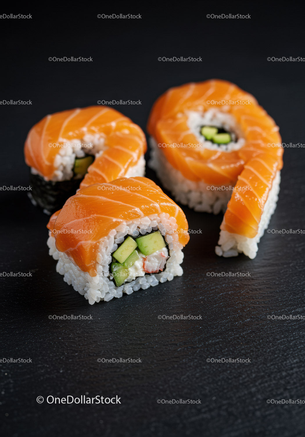 Fresh salmon sushi rolls with cucumber and crab