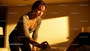 Woman gently waking up partner in warm morning light