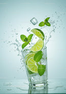 Refreshing lime and mint splash in glass with ice cubes