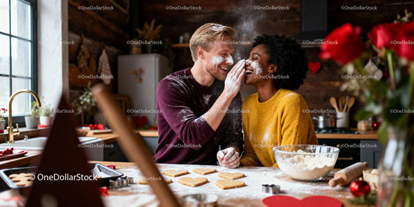 Couple playfully baking heart cookies in cozy kitchen