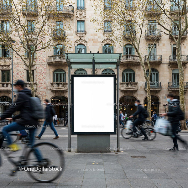 Urban scene with blank city billboard and passing cyclists JPG Mockup Image