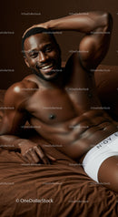 Smiling shirtless man relaxing on brown bed linen