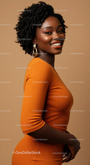 Vibrant Smiling Woman in Orange Dress with Jewelry Studio Portrait
