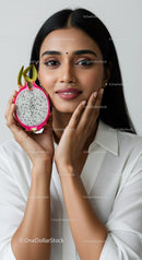 Young Woman Holding Fresh Dragon Fruit with Bright Smile