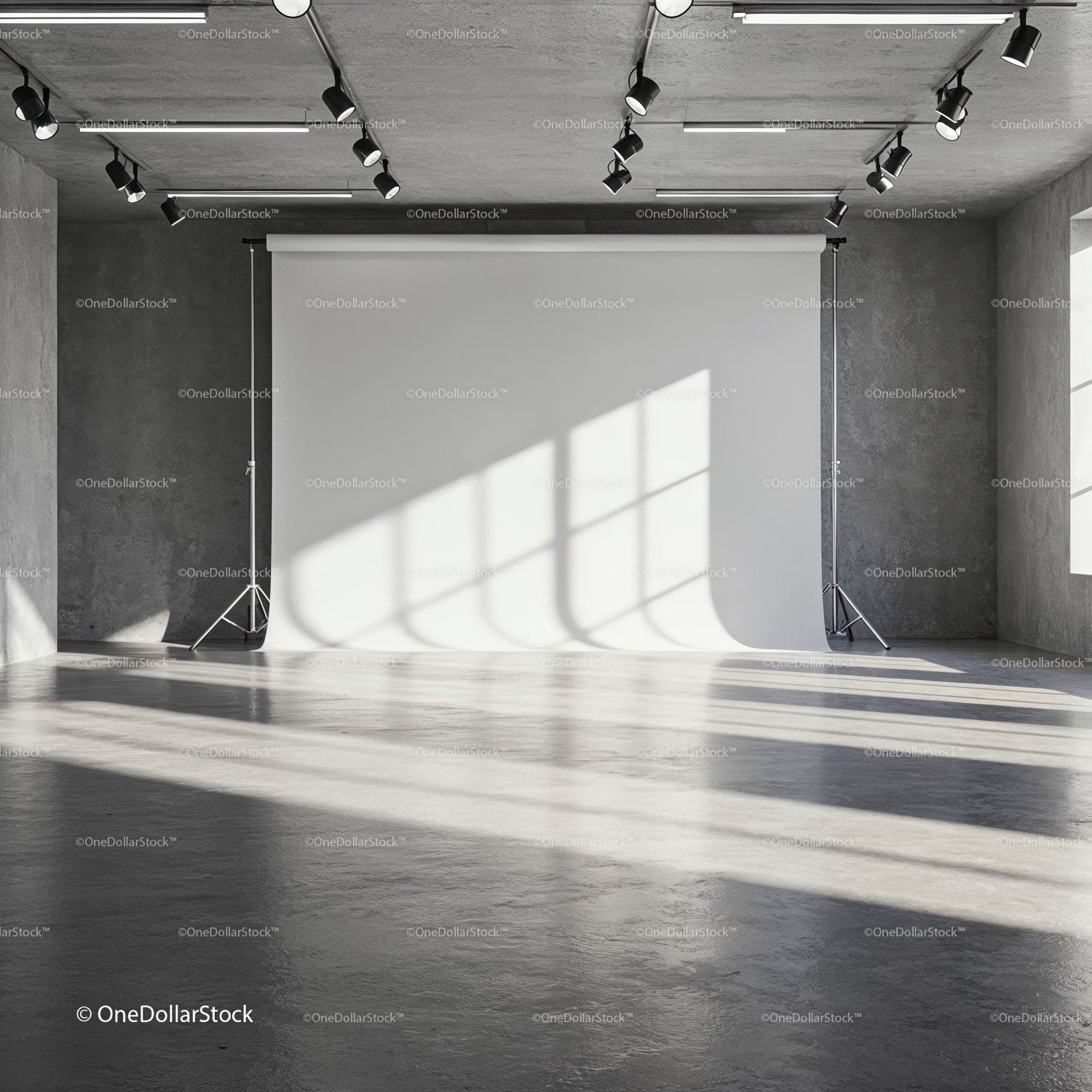 Empty photo studio with natural window light and backdrop
