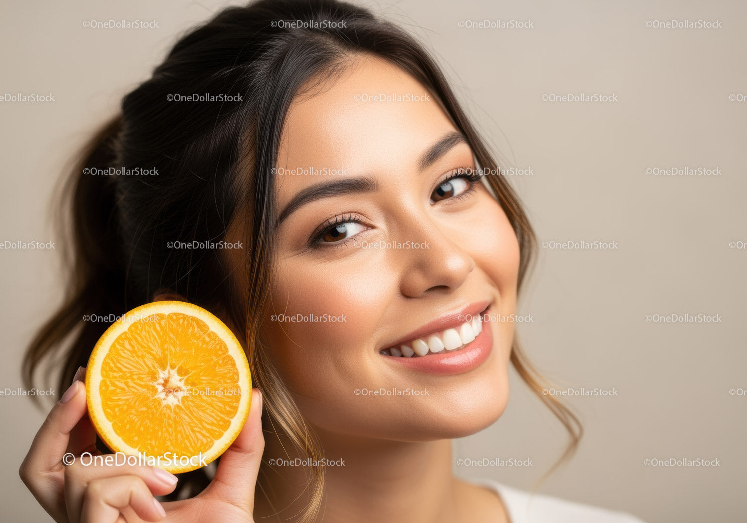 Bright Smiling Woman Holding Fresh Orange Slice for Healthy Lifestyle