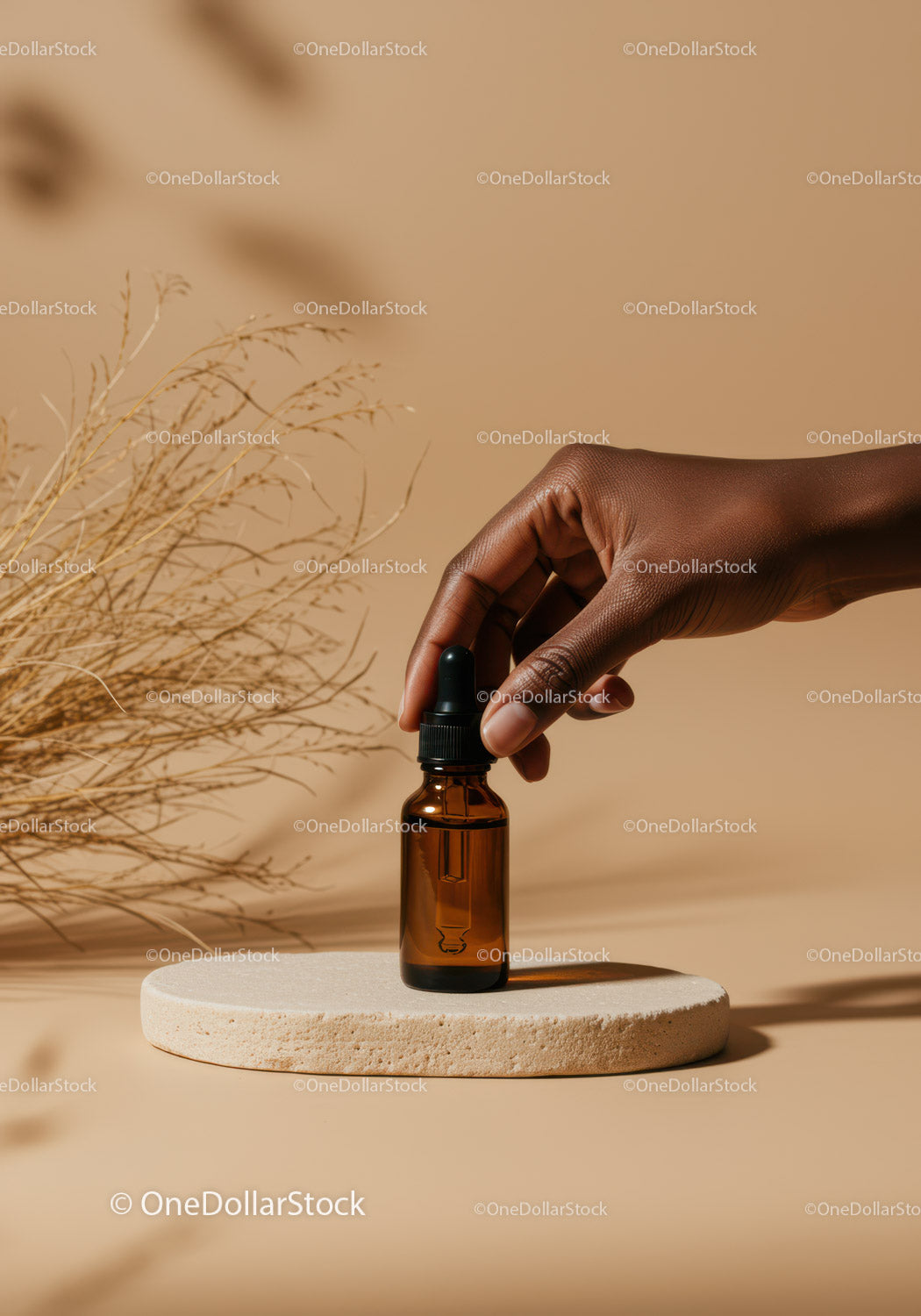 Minimalist Brown Dropper Bottle with Hand Holding Essential Oil