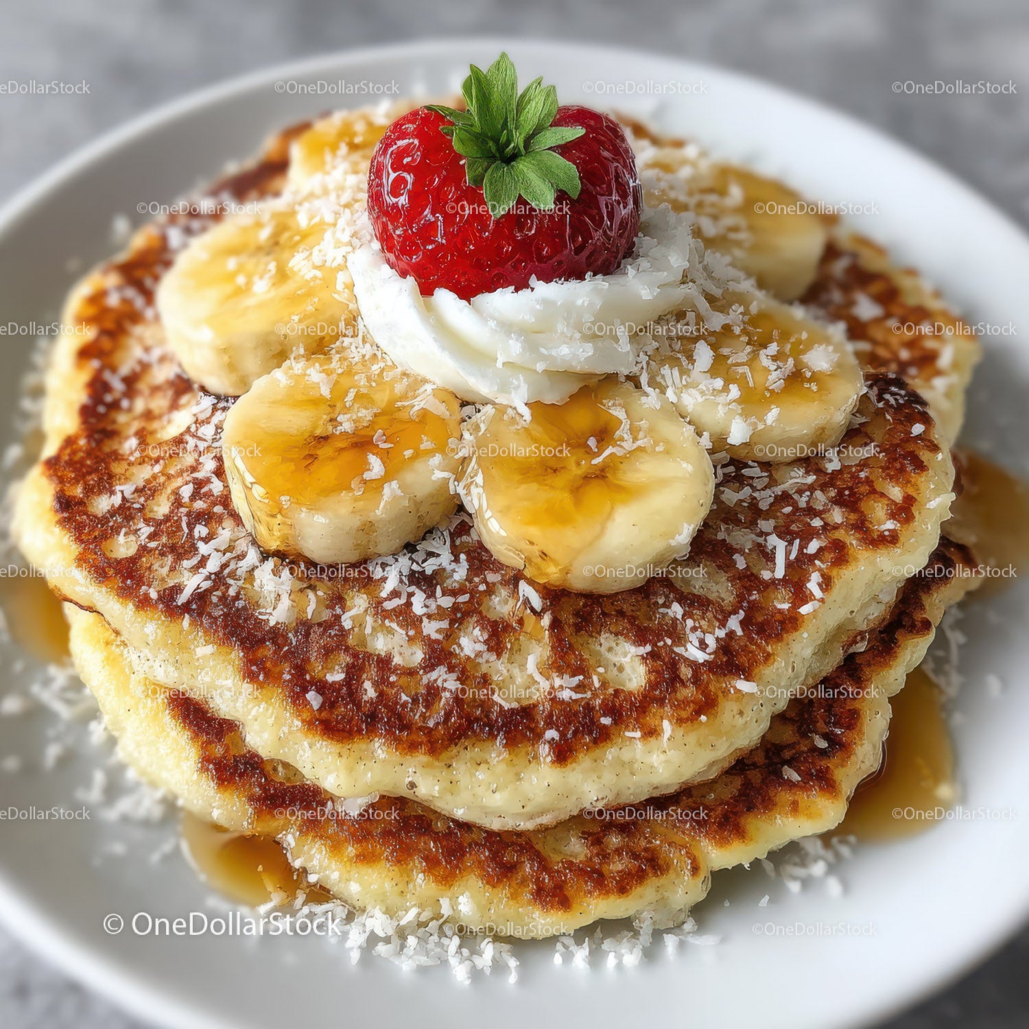 Pancake with Sliced Banana Strawberry Whipped Cream and Caramel Drizzle