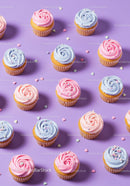 Colorful cupcakes with pastel frosting on purple background