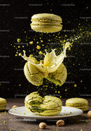 Green Pistachio Macarons with Cream Splash on Plate