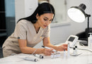 Female Scientist Conducting Medical Laboratory Research with Test Tubes