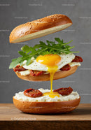 Fresh sandwich with fried egg dripping yolk