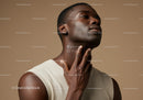 Elegant African Woman Applying Moisturizer for Flawless Skin
