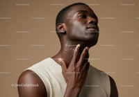 Elegant African Woman Applying Moisturizer for Flawless Skin