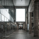 Modern Spacious Indoor Walkway with Large Lightbox Display
