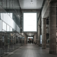 Modern Spacious Indoor Walkway with Large Lightbox Display