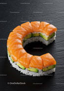 Fresh salmon avocado sushi roll on black slate