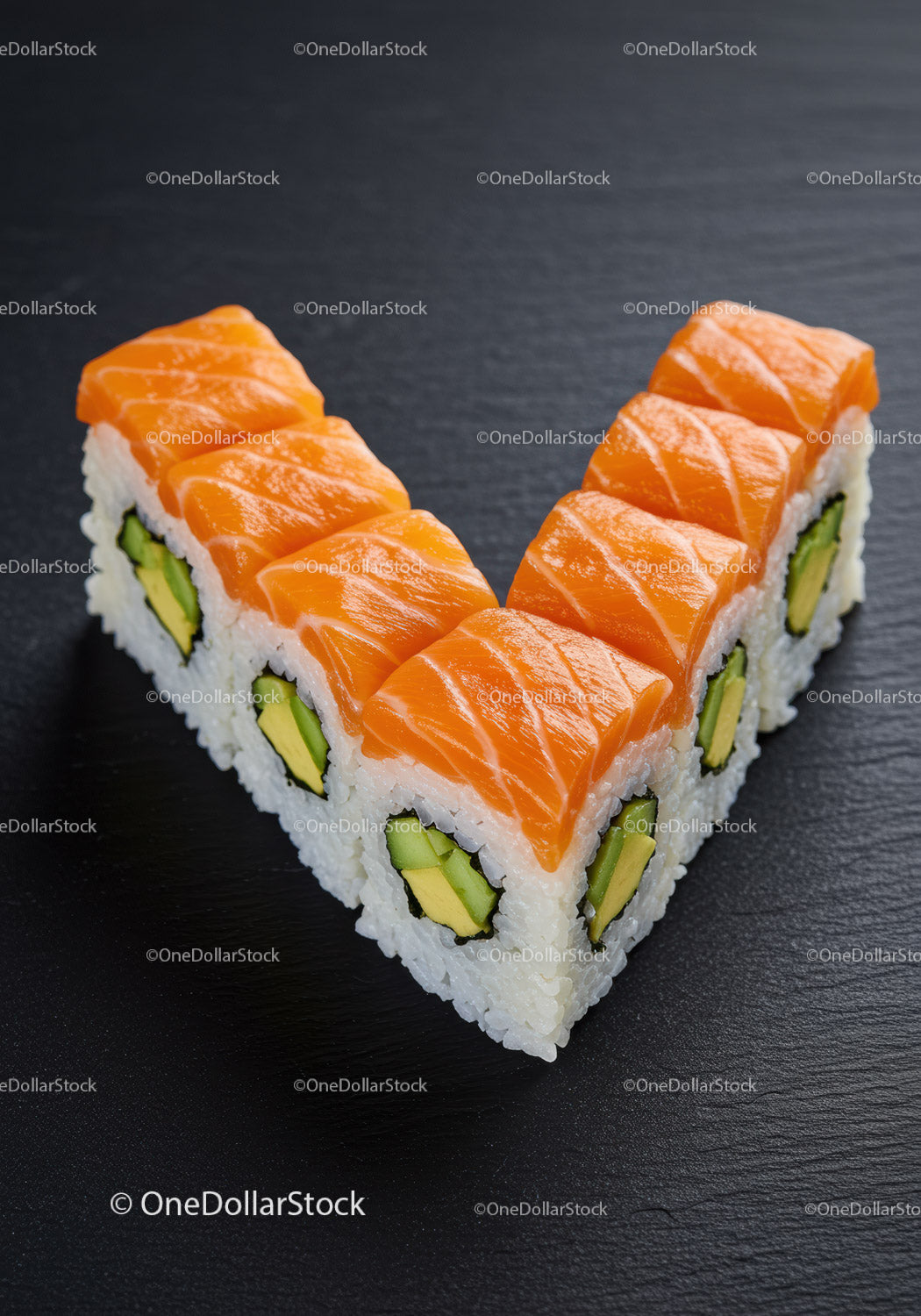 Fresh salmon sushi rolls arranged in a V shape