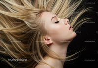 Blonde woman with flowing hair on black background