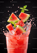 Refreshing watermelon juice splash with fresh mint leaves