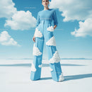 Fashion Model in Sky Blue Outfit with Cloud Pattern Pants in Outdoor Scene