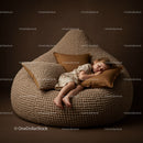 Child peacefully sleeping on textured brown bean bag