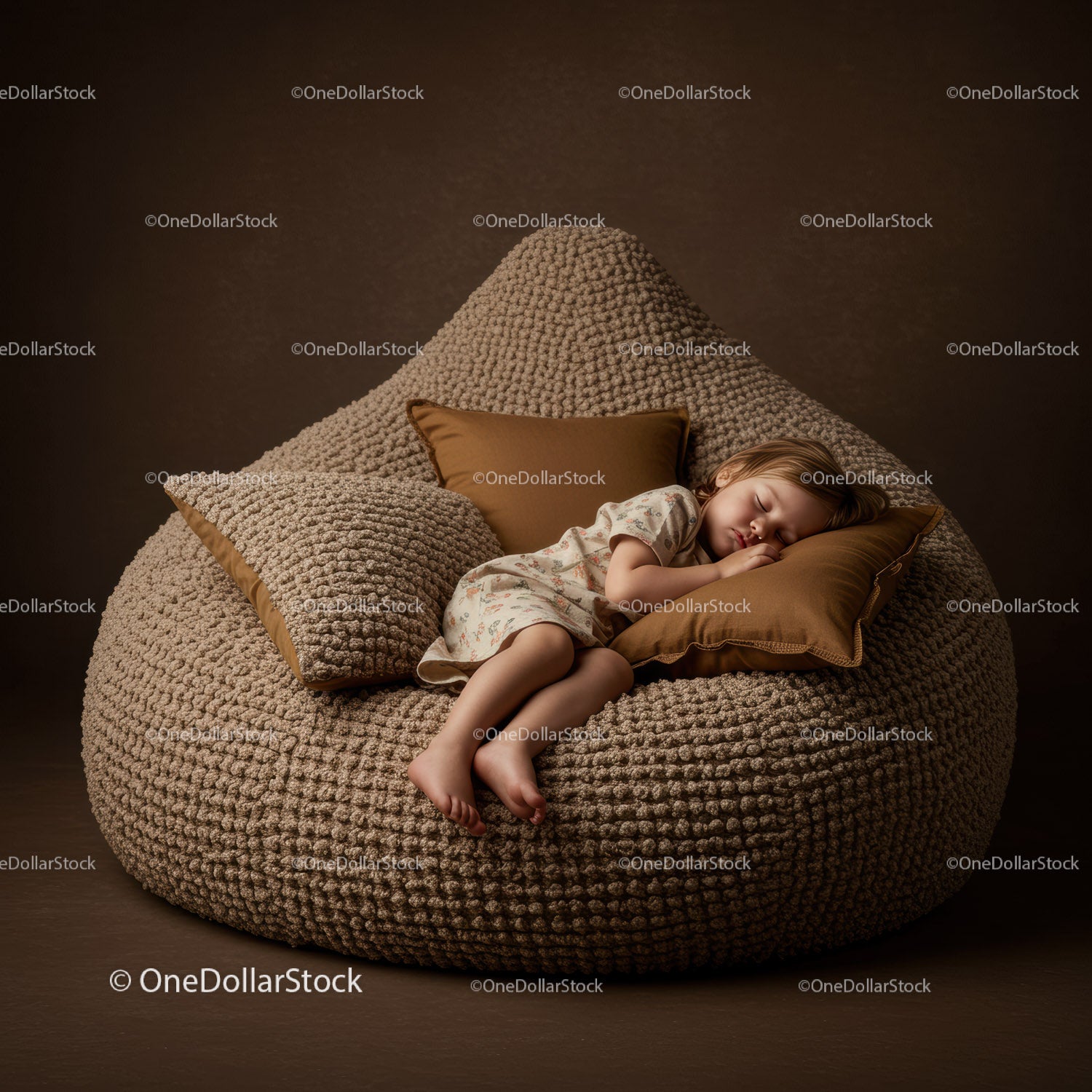Child peacefully sleeping on textured brown bean bag