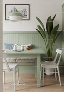Minimalist Green and White Dining Nook with Houseplant and Modern Decor