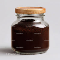 Glass Jar Filled with Fine Ground Coffee and Coffee Beans