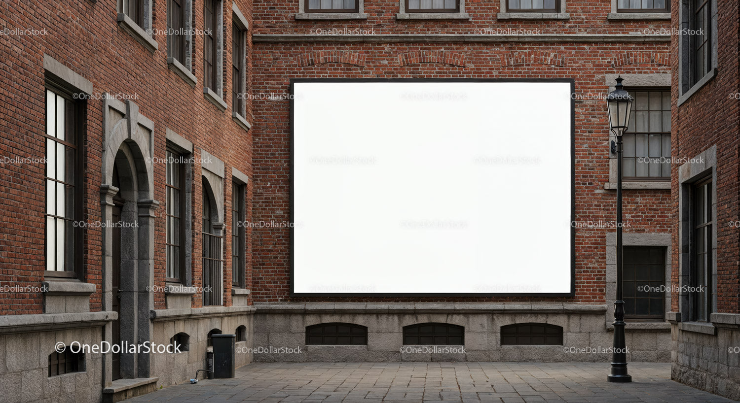 Blank billboard on brick wall in urban courtyard