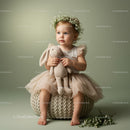 Toddler girl with flower crown holding soft bunny toy