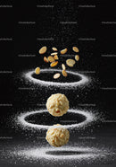 Almond Truffles with Powdered Sugar in Dark Setting