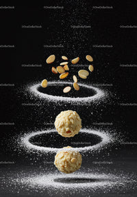 Almond Truffles with Powdered Sugar in Dark Setting