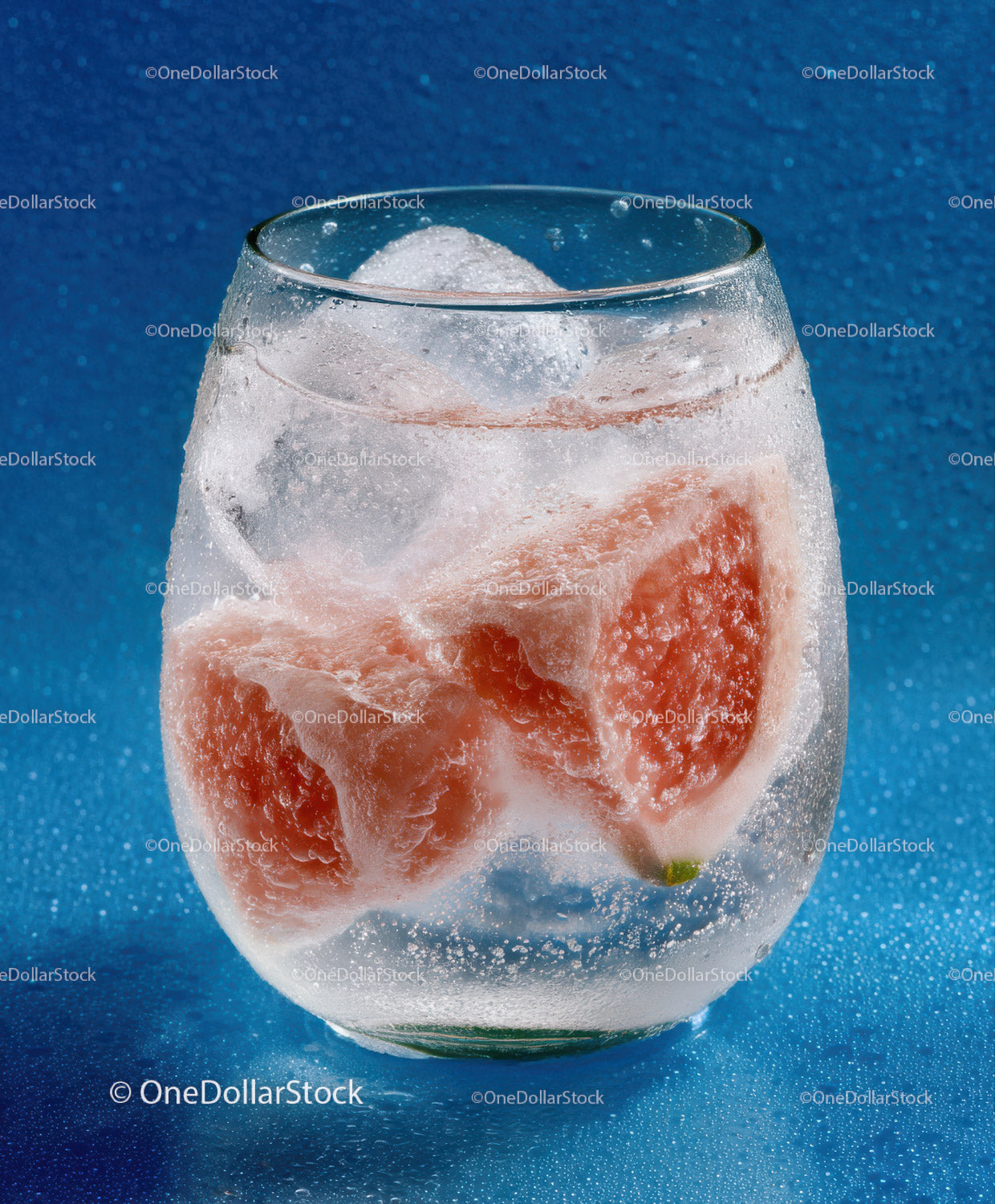 Ice Water with Grapefruit Slices in Clear Glass for Refreshing Summer Drink