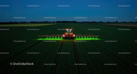 Nighttime Agricultural Spraying in Bright Green Light