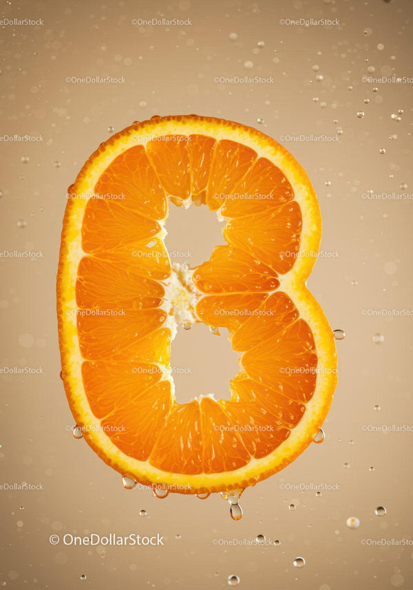 Fresh Orange Slice Shaped Like Number Eight with Water Droplets