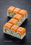 Fresh salmon sushi rolls with avocado and cream cheese