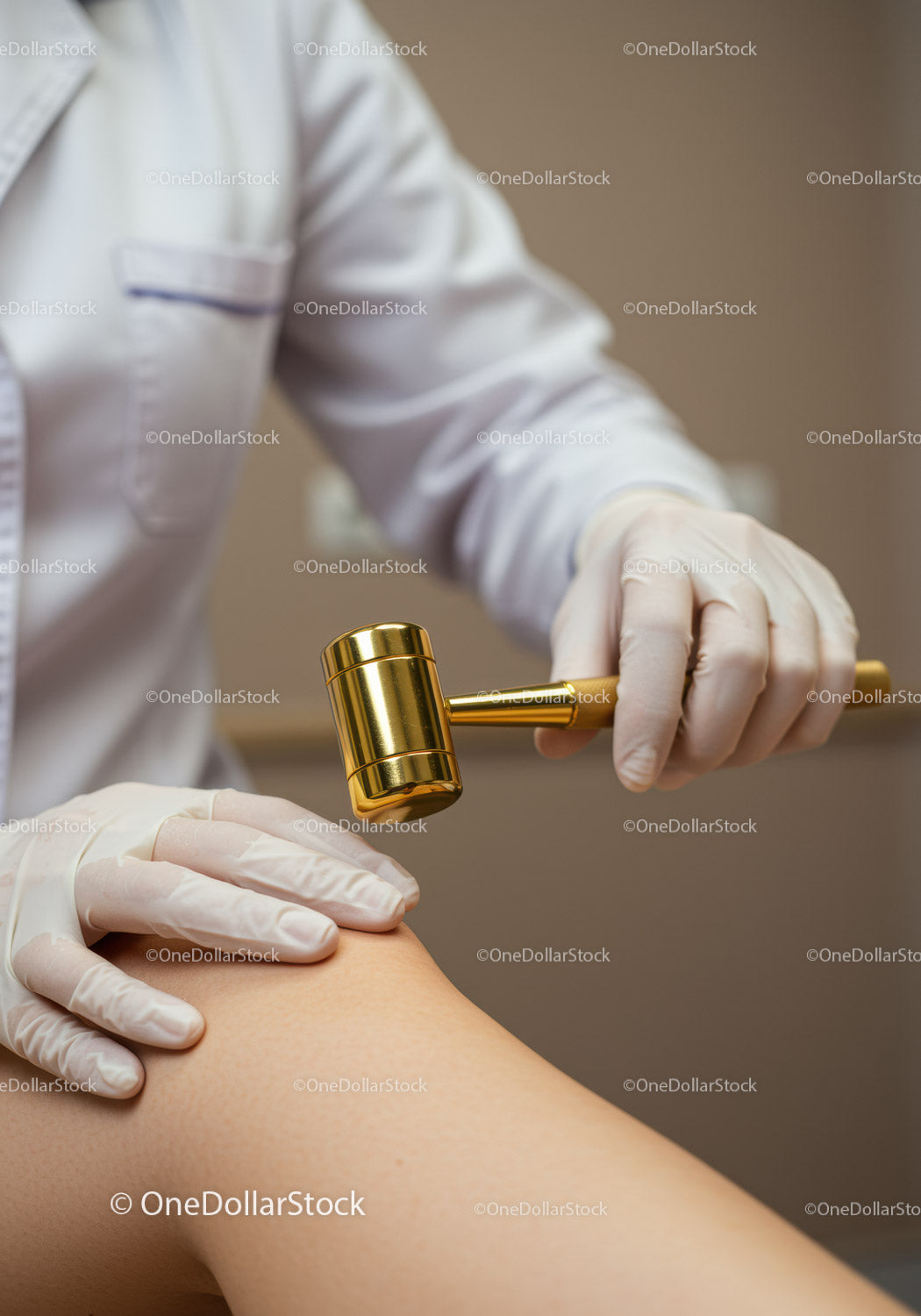 Doctor Using Gavel on Patient's Knee During Medical Examination