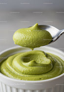 Creamy Green Avocado Dip in White Bowl with Spoon