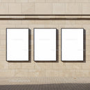 Three Blank Posters on Beige Stone Wall Outdoors