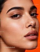 Close-up of natural glowing skin with defined eyebrows