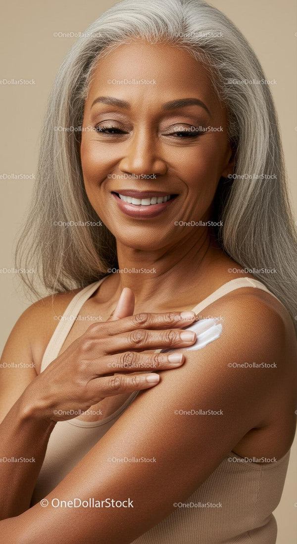 Elegant Mature Woman Applying Skin Lotion for Healthy Aging