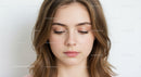 Portrait of Young Woman with Natural Makeup and Soft Expression