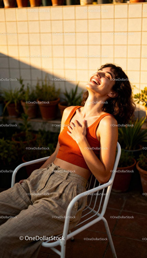 Young woman enjoying golden hour sunlight outdoors