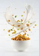 Splash of Milk Pouring into Bowl with Cereal and Nuts