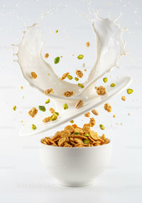 Splash of Milk Pouring into Bowl with Cereal and Nuts