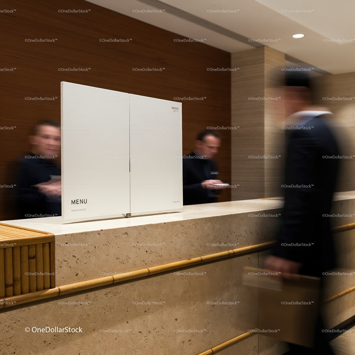 Businessmen interacting at modern hotel reception desk