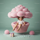 Toddler Sitting Inside a Giant Pink Cupcake Set